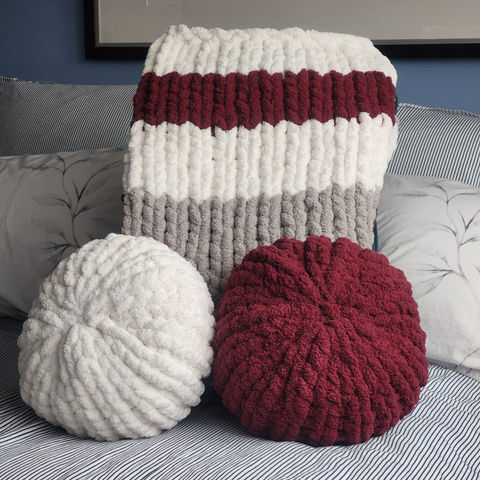 Woolie sock blanket with matching chunky knit pillows
