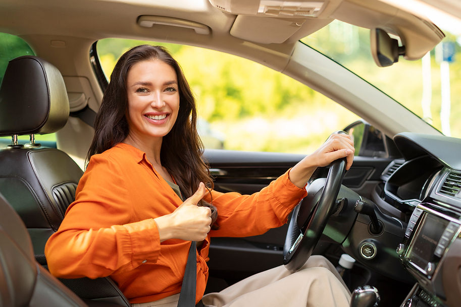 driving-school-happy-lady-showing-thumbs-up-sitting-inside-car-drivers-seat-woman-making-a
