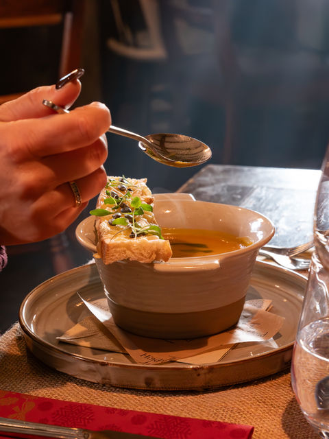 Professional photograph of a festive menu item, soup.