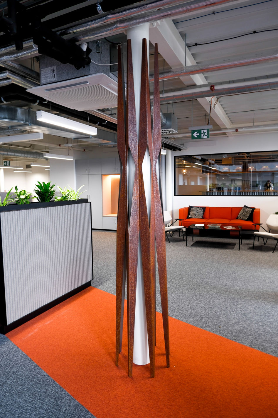 Corten steel sculpture. Column. Interior.