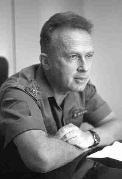 Yitzhak Rabin leaning on a table