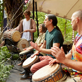 Somesh drumming at medicine festival.jpeg
