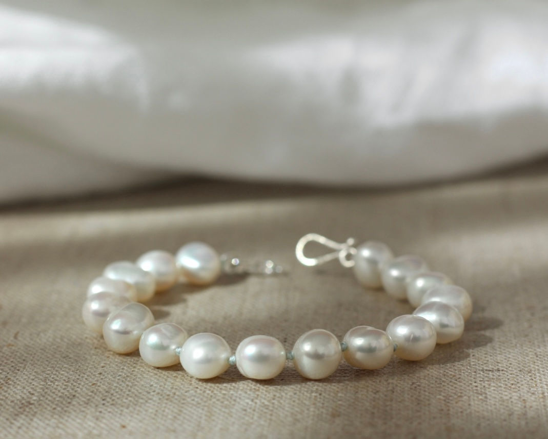 FRESHWATER PEARL BRACELET WITH BABY BLUE SILK THREAD