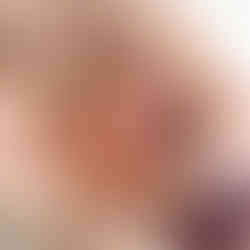 Big sisters holding newborn sister