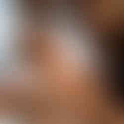 Mom and dad holding newborn baby boy