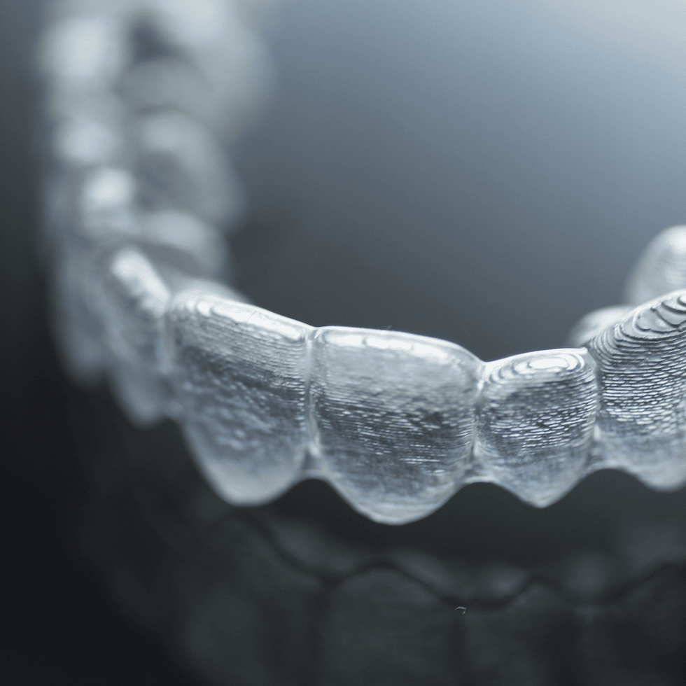 Invisalign provider in Dobbs Ferry showing clear aligners.png