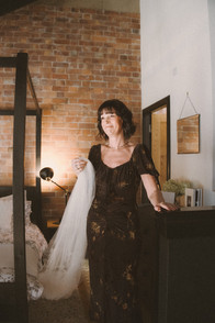 Woman holding Georgia’s veil during bridal preparation