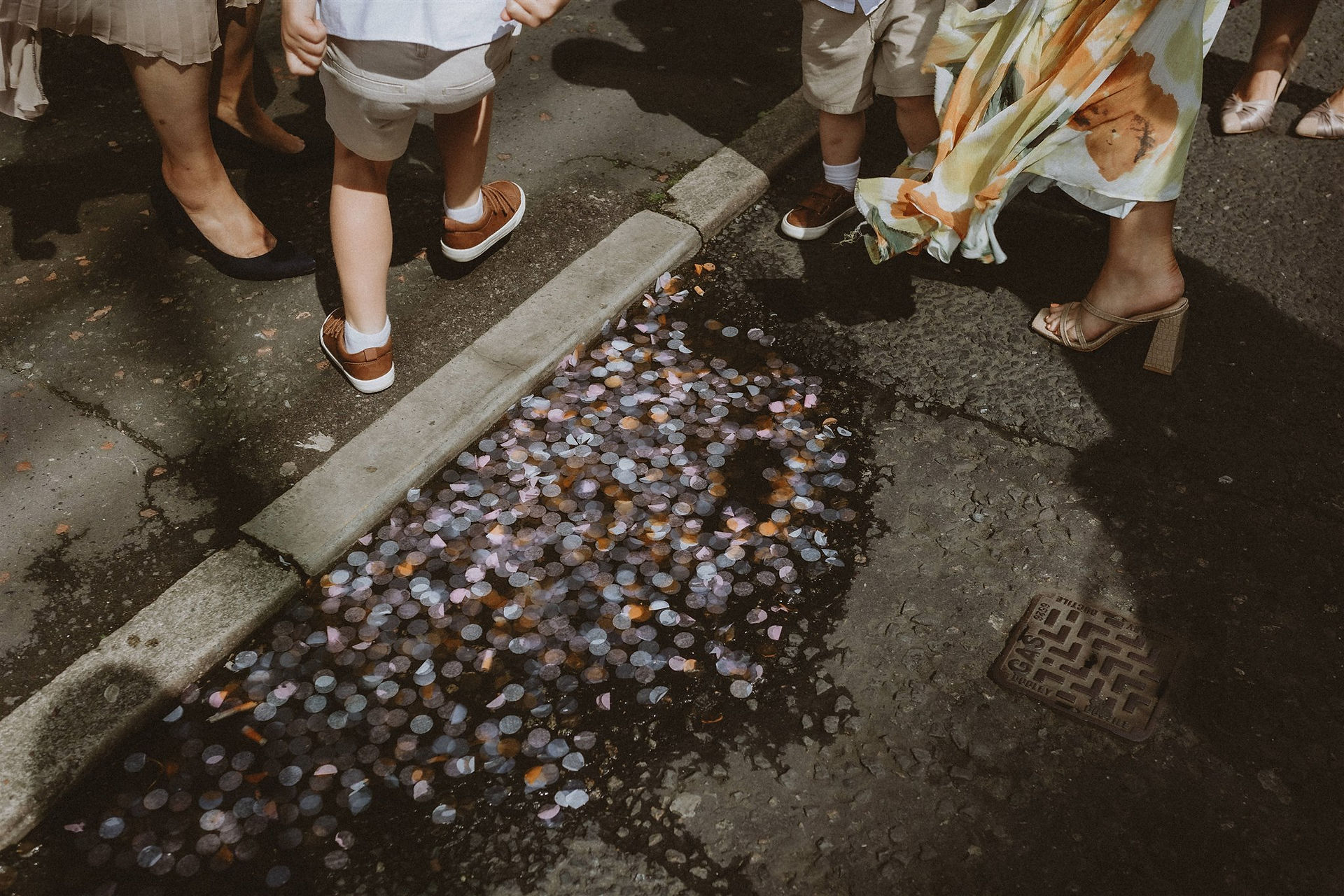 Confetti remnants in a puddle in Manchester