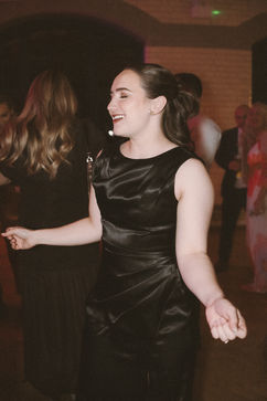 A Wedding guest dancing at Georgia and Will’s reception