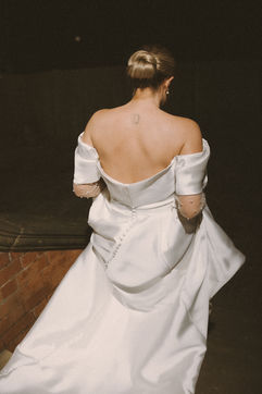 Georgia’s backless wedding dress during evening celebrations at The Pumping House