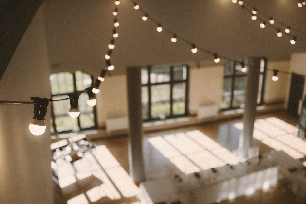 Festoon lights and winter sunshine inside The Pumping House wedding venue in Ollerton