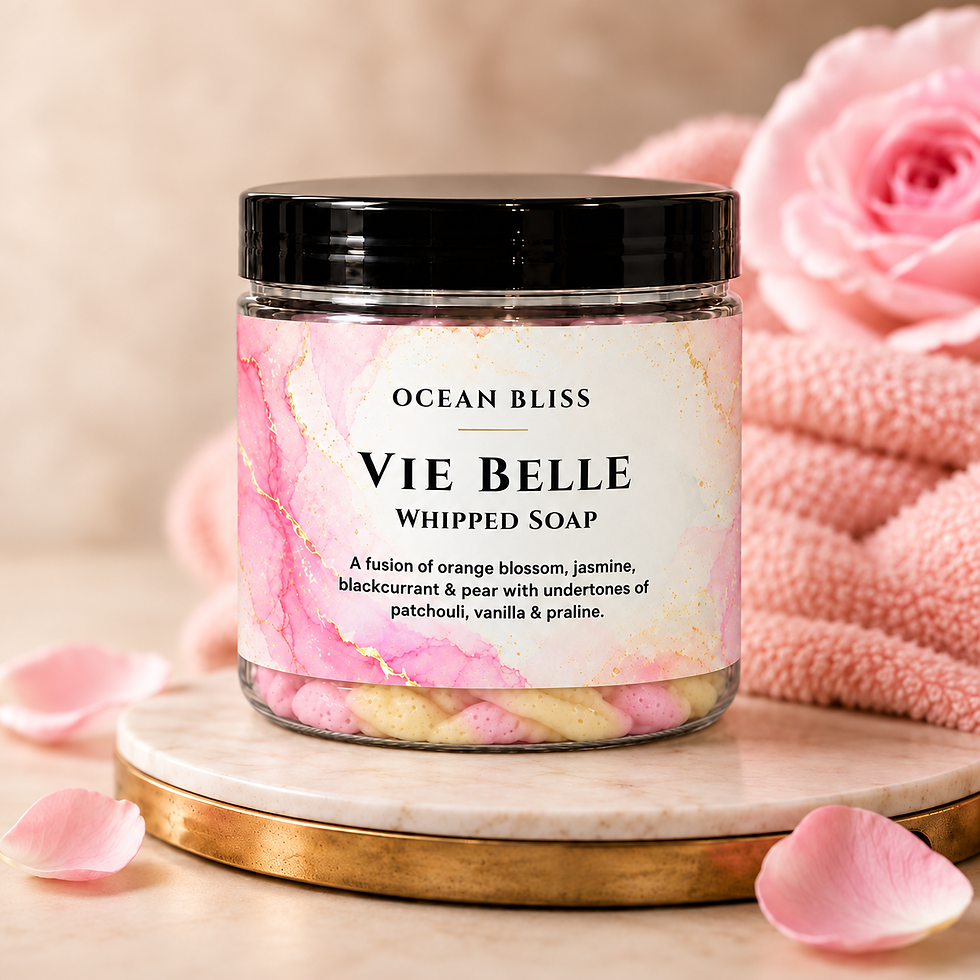 Ocean Bliss Vie Belle whipped soap with pink and yellow piped soap on a warm beige background