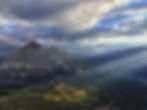 Sunlight over the 5 Torri with the Tofane peaks in the background, a dramatic Dolomites landscape near Cortina d’Ampezzo.