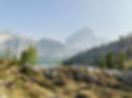 Hikers standing on a rocky ridge with panoramic views of the Tofana di Rozes and surrounding Dolomites peaks near Cortina d’Ampezzo.