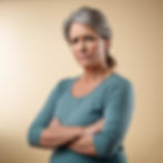an upset middle aged woman from the waist up looking at the camera standing at an angle wi