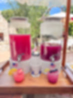 Pink lemonade and water dispensers with coordinating cups