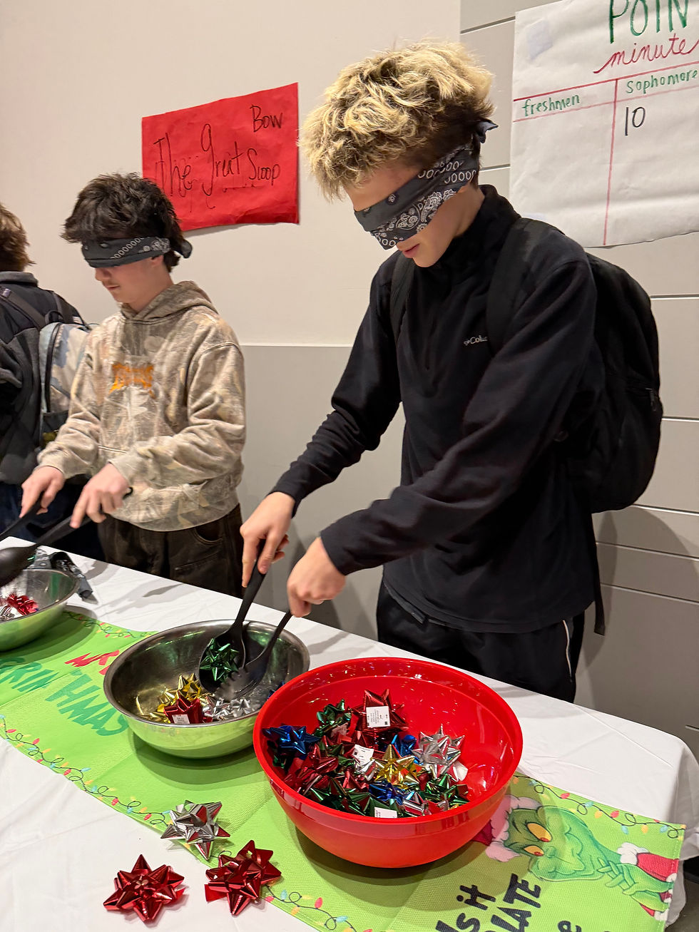 Ian Davelaar (9) faces off against Caleb Bozorth (10) in the bow scoop challenge at lunch on December 15. Photo credit: Roselyn Robison