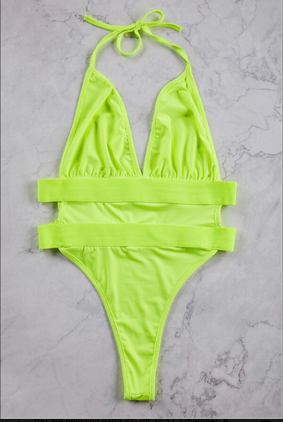 Thumbnail: Neon green swimsuit with straps, perfect for a beach vacation