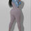Thumbnail: Woman in a mauve jumpsuit and denim jacket Madame Curves pose.