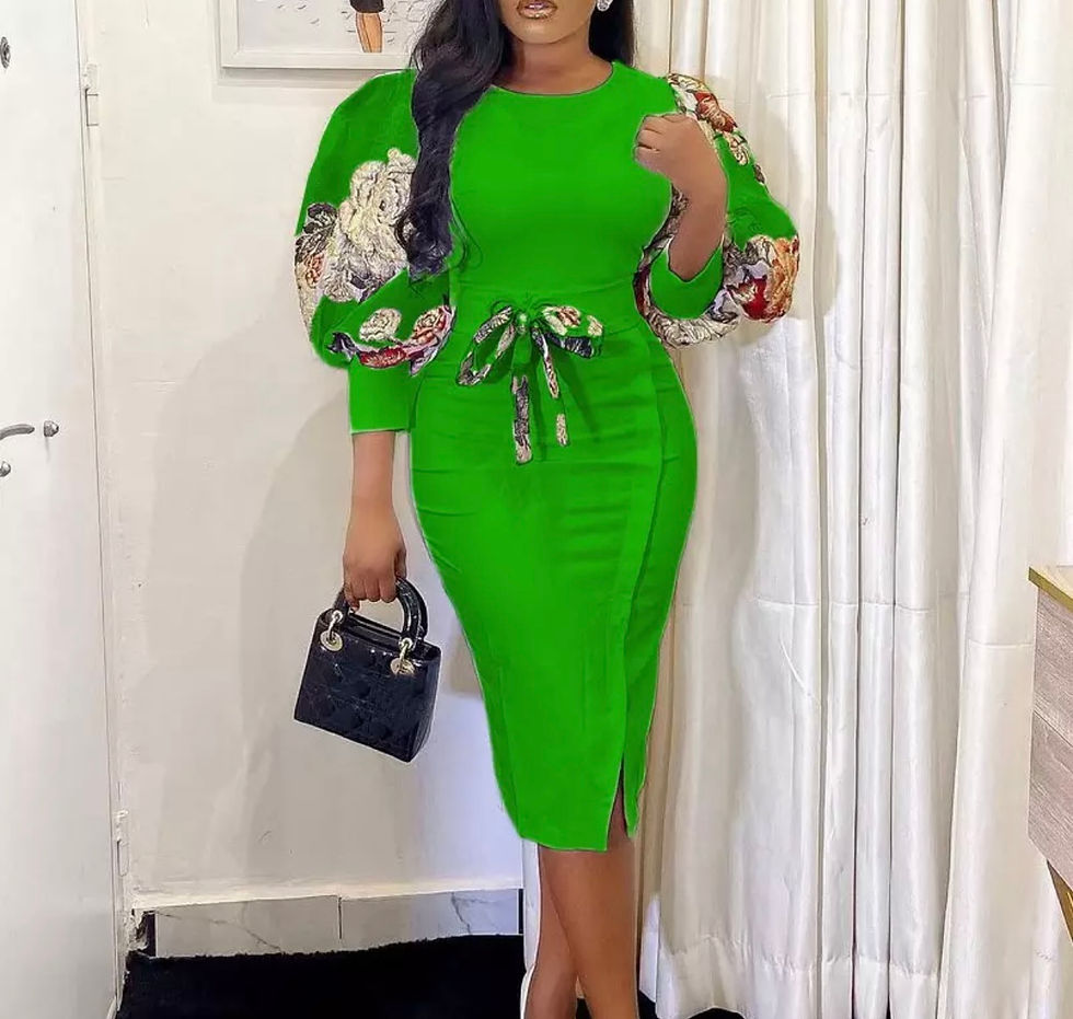 Thumbnail: Woman in green dress, floral sleeves, holding purse. Madame Curves.