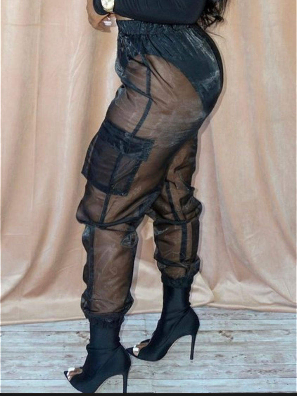Thumbnail: Woman wearing sheer black pants with pockets posing. Madame Curves.