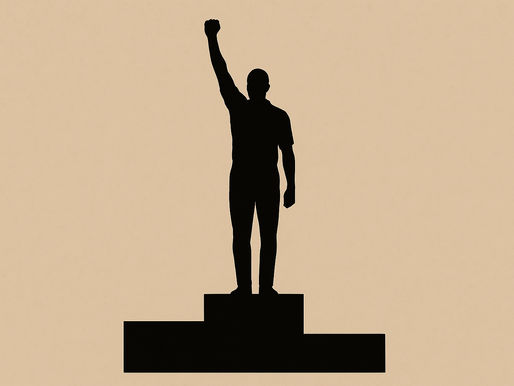 Silhouette of a person standing on a podium with one fist raised in the air, symbolising protest or solidarity, set against a beige background.