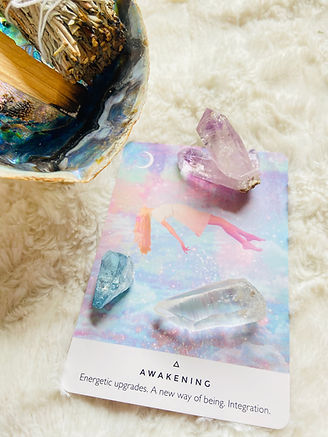 oracle card with crystal on table