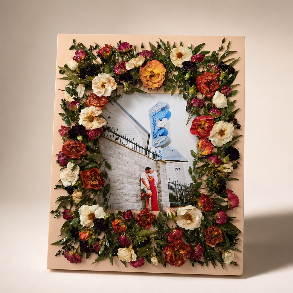 Wedding photo framed by pressed roses, ranunculus and greenery, a keepsake by ADONIA Studios