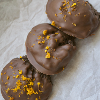 Chocolate orange cookie dipped in chocolate and topped with fresh orange zest