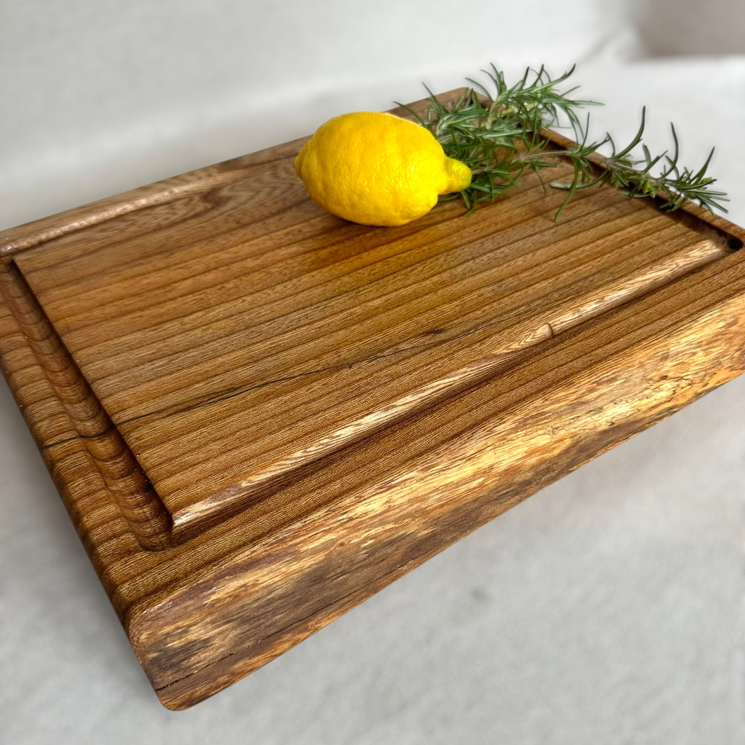 The Elm Carver: solid elm chopping board with juice groove
