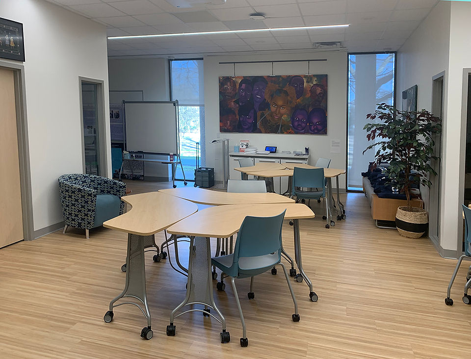 Desks and chairs arranged in a room for student collaboration workspace