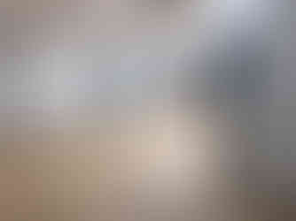 Open room with wood floors before renovation