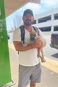 Man holding puppy