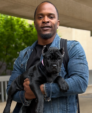 Man holding a puppy