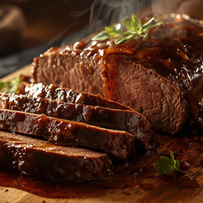 Tender braised brisket sliced against the grain and covered in a rich, glossy sauce with onions.