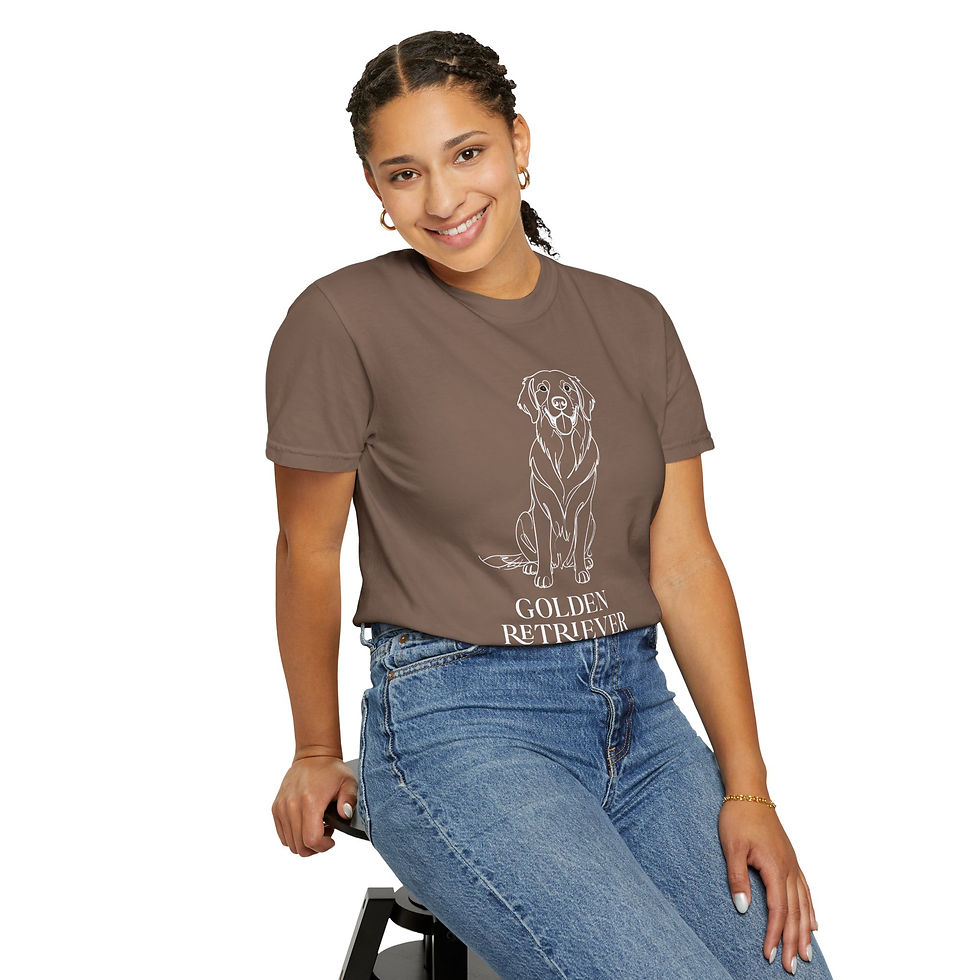 Thumbnail: Woman sitting and modeling a dark brown unisex t-shirt with a white minimalist Golden Retriever dog line art design