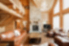 An open plan living room log cabin Chaletat Chaletsoasis in Quebec, Canada.