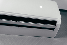 White air conditioner unit displaying 22 degrees_edited.png