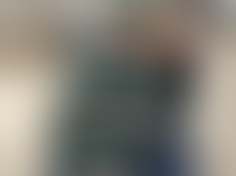 A Reiki practitioner doing Reiki on a client laying down