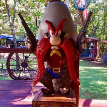 Yosemite Sam custom character chainsaw carving by C.Worden