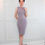 Thumbnail: A short haired lady wearing a JACQ gray sheath dress.