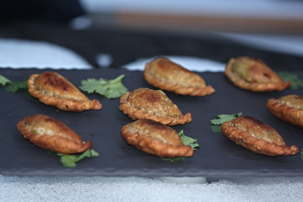 Yummy pea samosas against a white snowy background