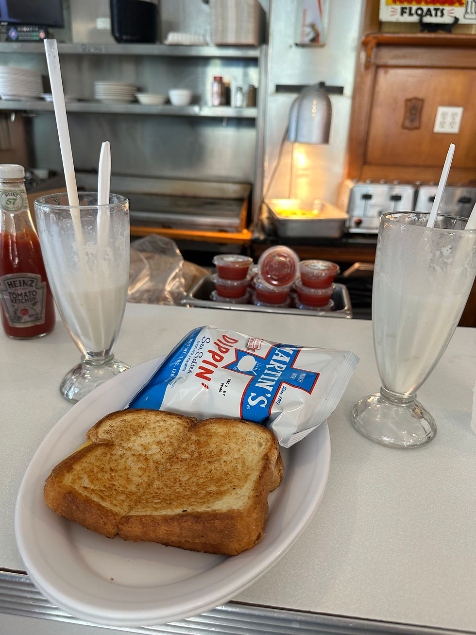 Miles and I's special grilled cheese, chips, and a malt shake split for two