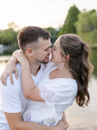 engaged couple holding each other at Lake Watauga in Nashville