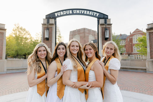 a group of purdue graduate girls cuddled up 