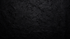 Black textured concrete background.png
