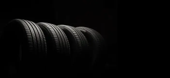 Car tires on black background for copy space _ Premium Photo (1).webp