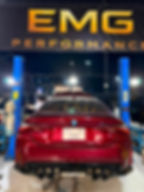 Red BMW M4 at the EMG Performance workshop in Dubai