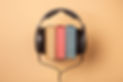 headphones on books, audiobooks concept.jpg