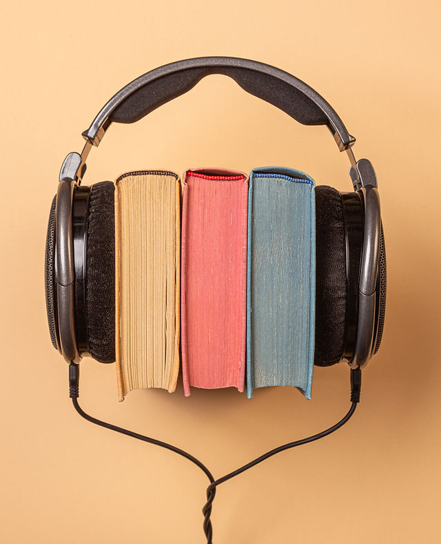 headphones on books, audiobooks concept.jpg